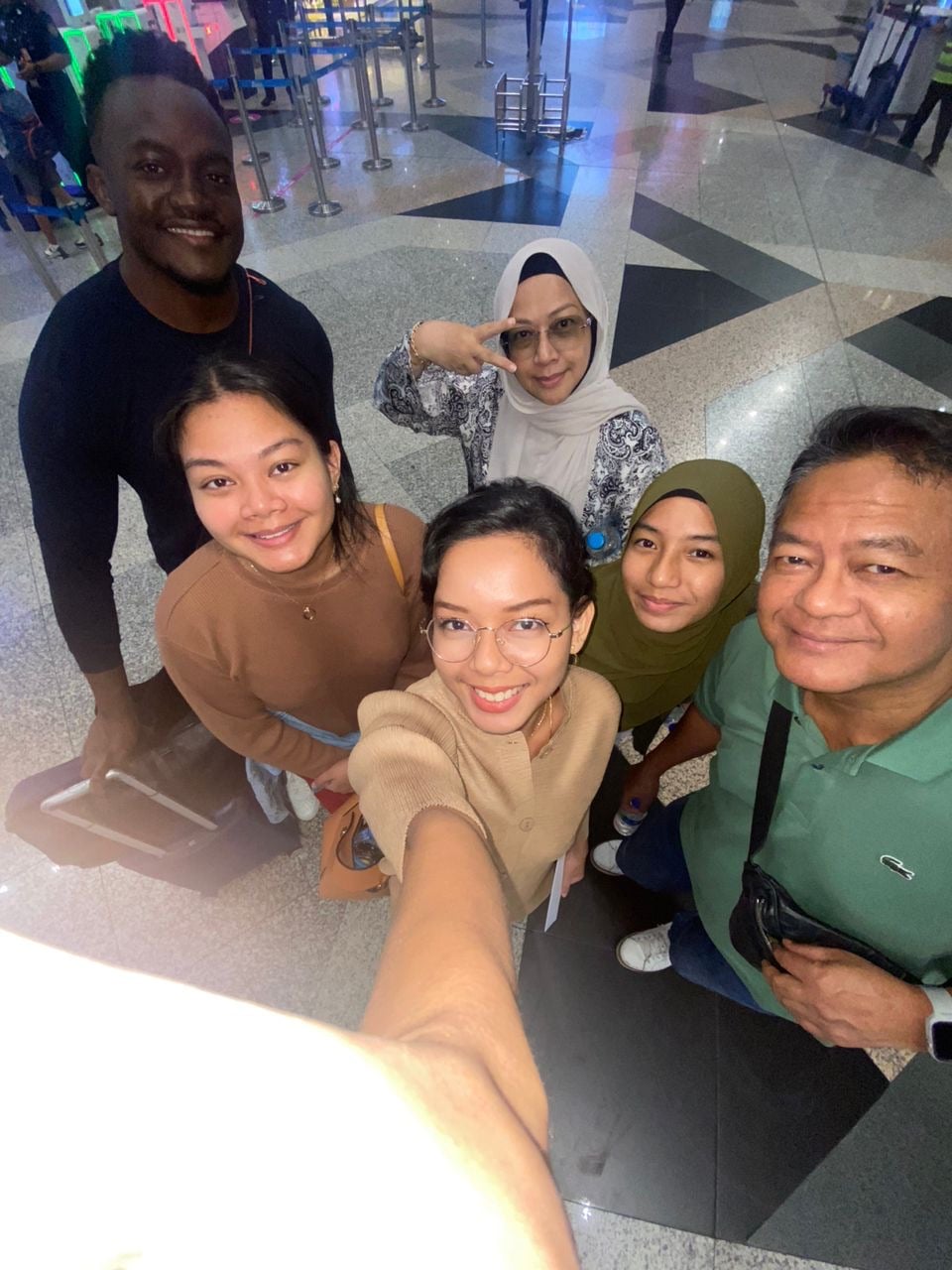 First trip to Malaysia with family group photo